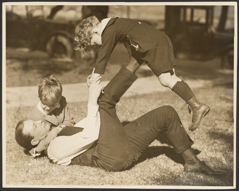 [Man playing with two boys]