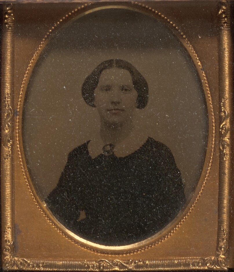 [Young woman seated]