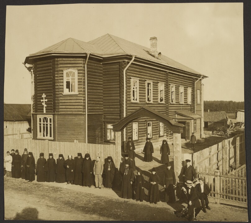 Makarevsky Retreat, Priests in front of large house