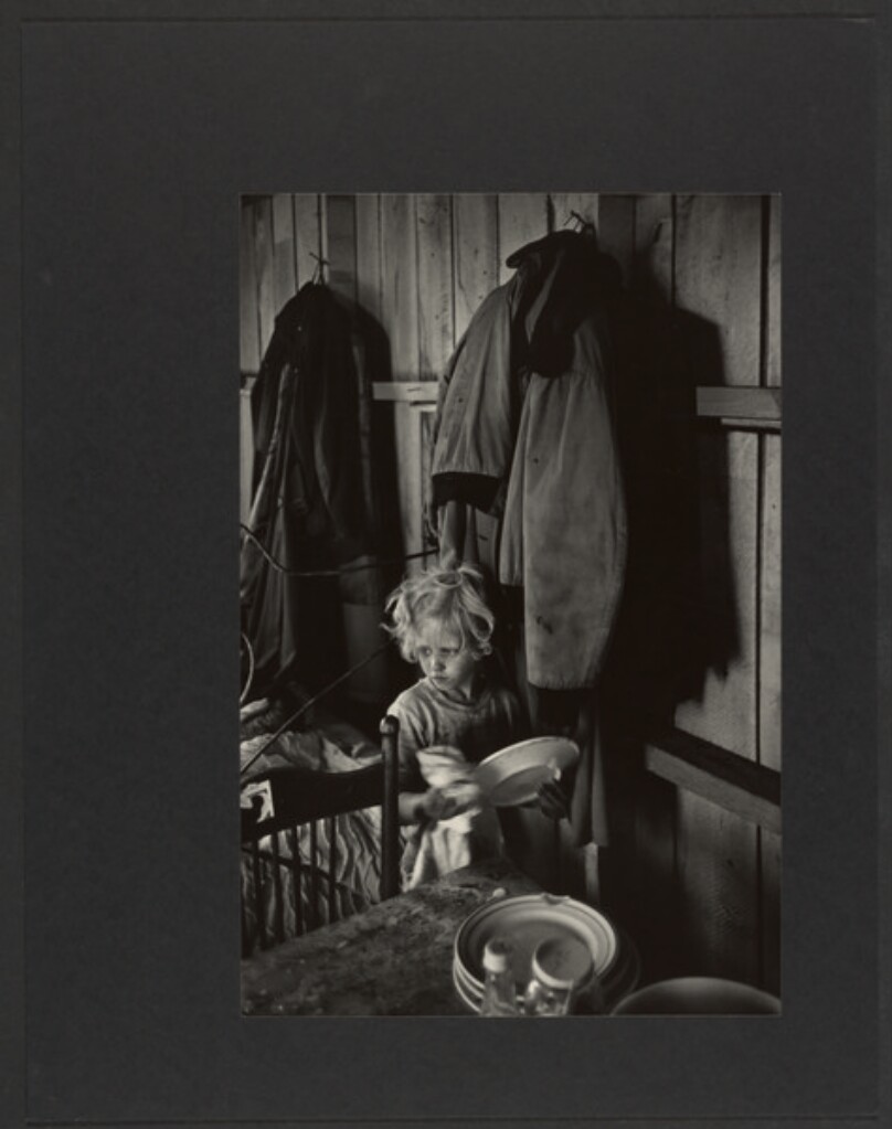 [Little Migrant Girl Carrying Dishes]