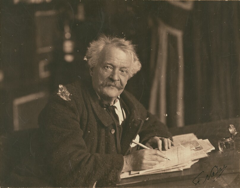 [Félix Nadar seated at writing table]