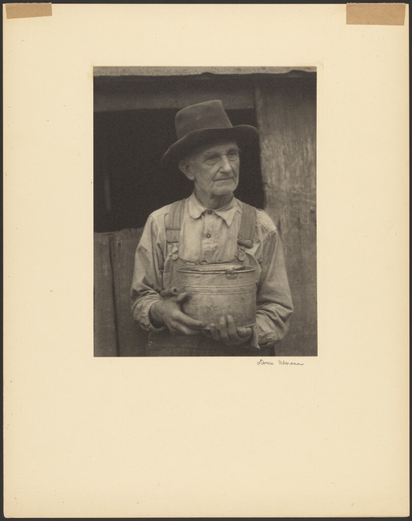[Elderly Man in Dark Hat with Tin Pail]