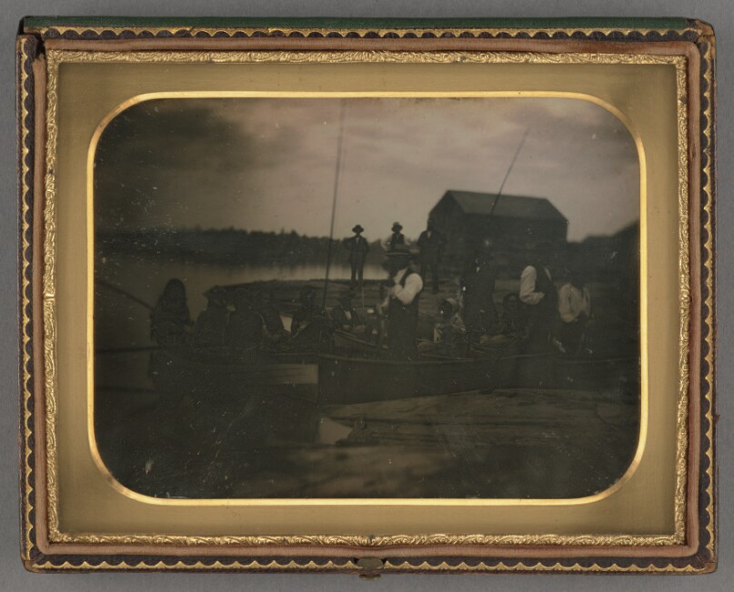 [Group of men and women on a fishing boat]