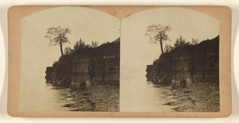 [View of unidentified shoreline with cliff, beach and trees, somewhere in Pennsylvania]
