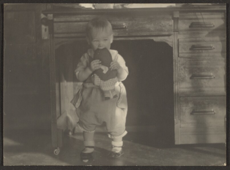 [Baby Chewing on Doll]