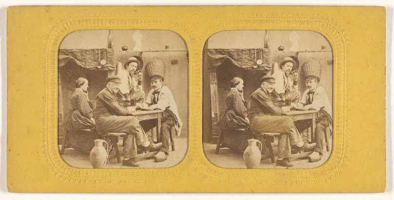 [Three men and a woman seated at a table drinking]