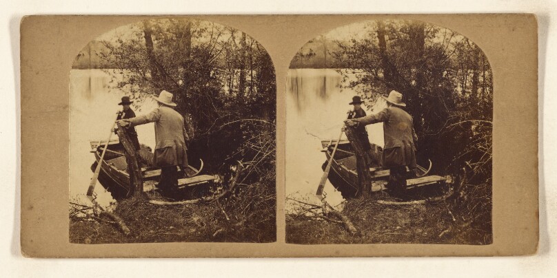 [Two men in a rowboat on lake shore about to take off]