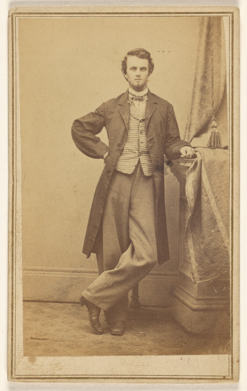 [Unidentified young bearded man, standing]