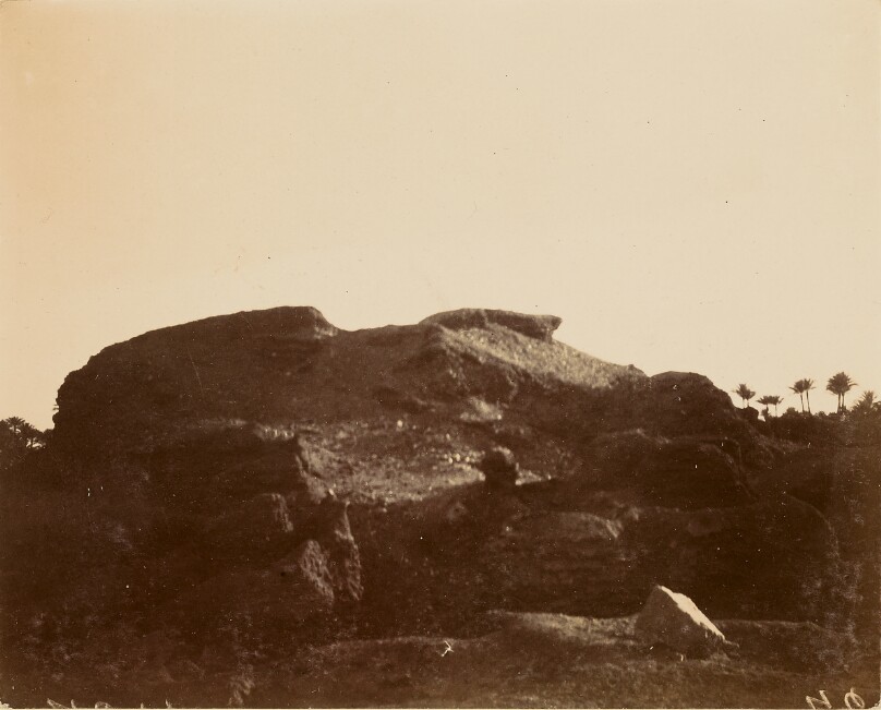[Desert landscape in shadow]