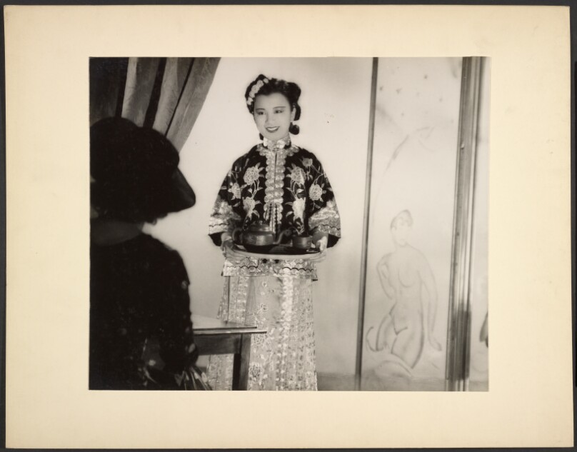 [Woman serving tea]