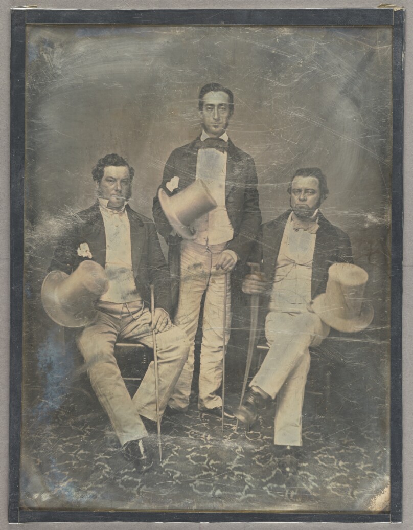 [Portrait of Three Men Holding Top Hats]