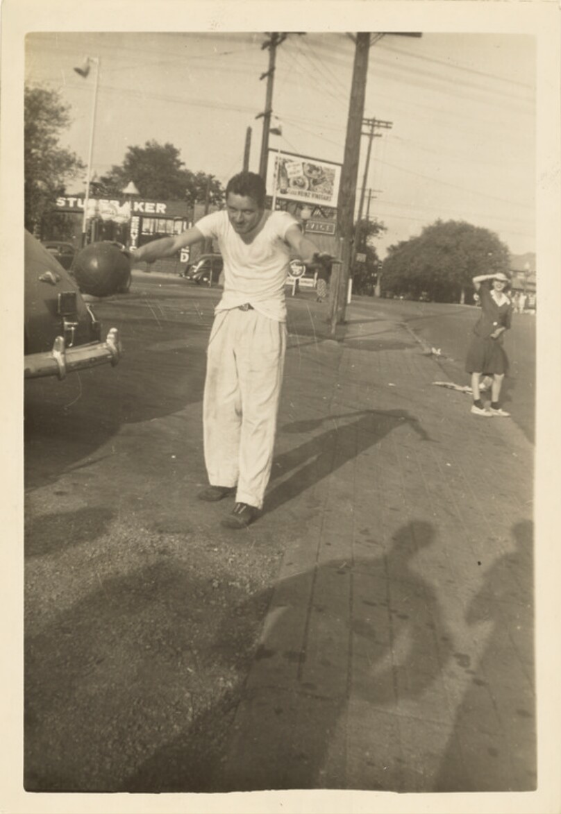 [Man holding a basketball]