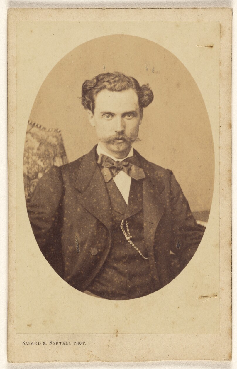[Unidentified man with handlebar moustache, printed in quasi-oval style]