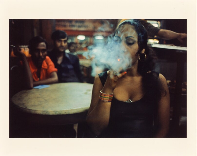 Transwoman smoking in the Olympia Cafe, Falkland Road, Bombay, India