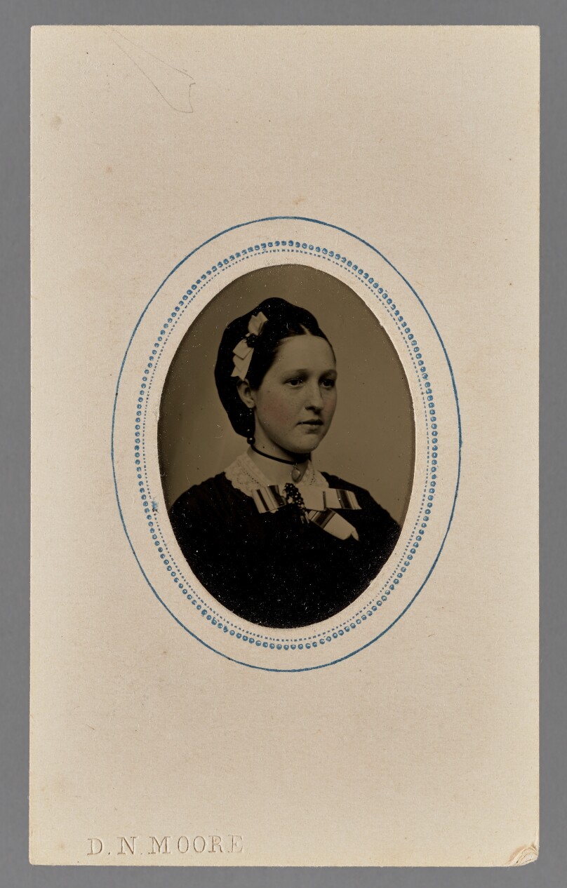 [Portrait of a young woman with a bow in her hair]
