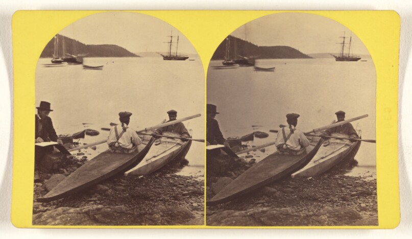 Esquimaux and their boats.