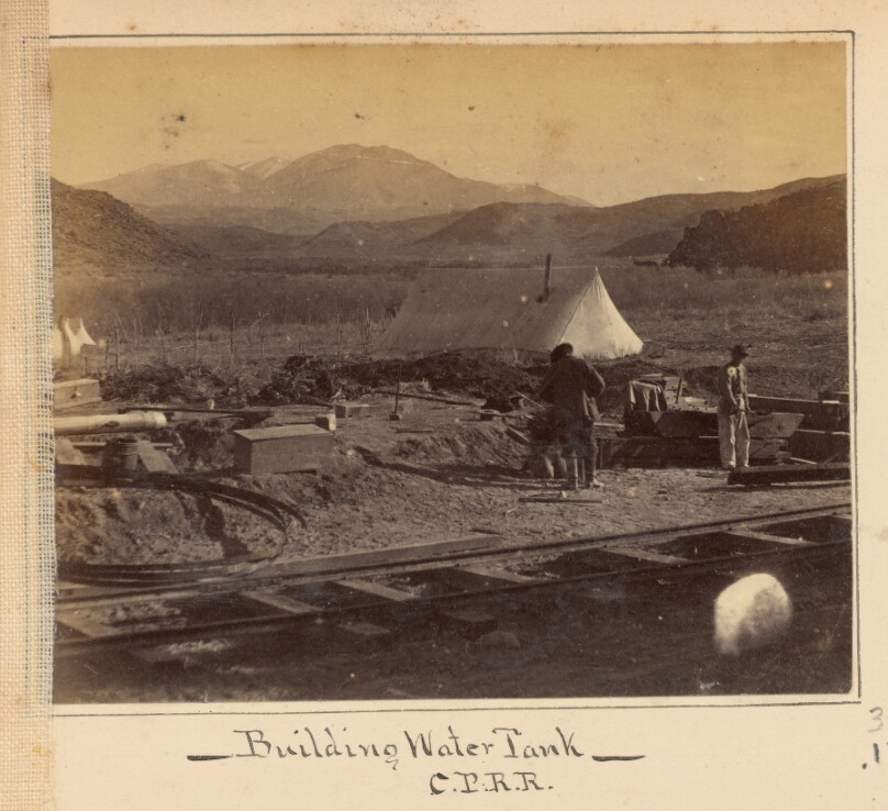 Building Water Tank. Trout Creek Mountains in Distance