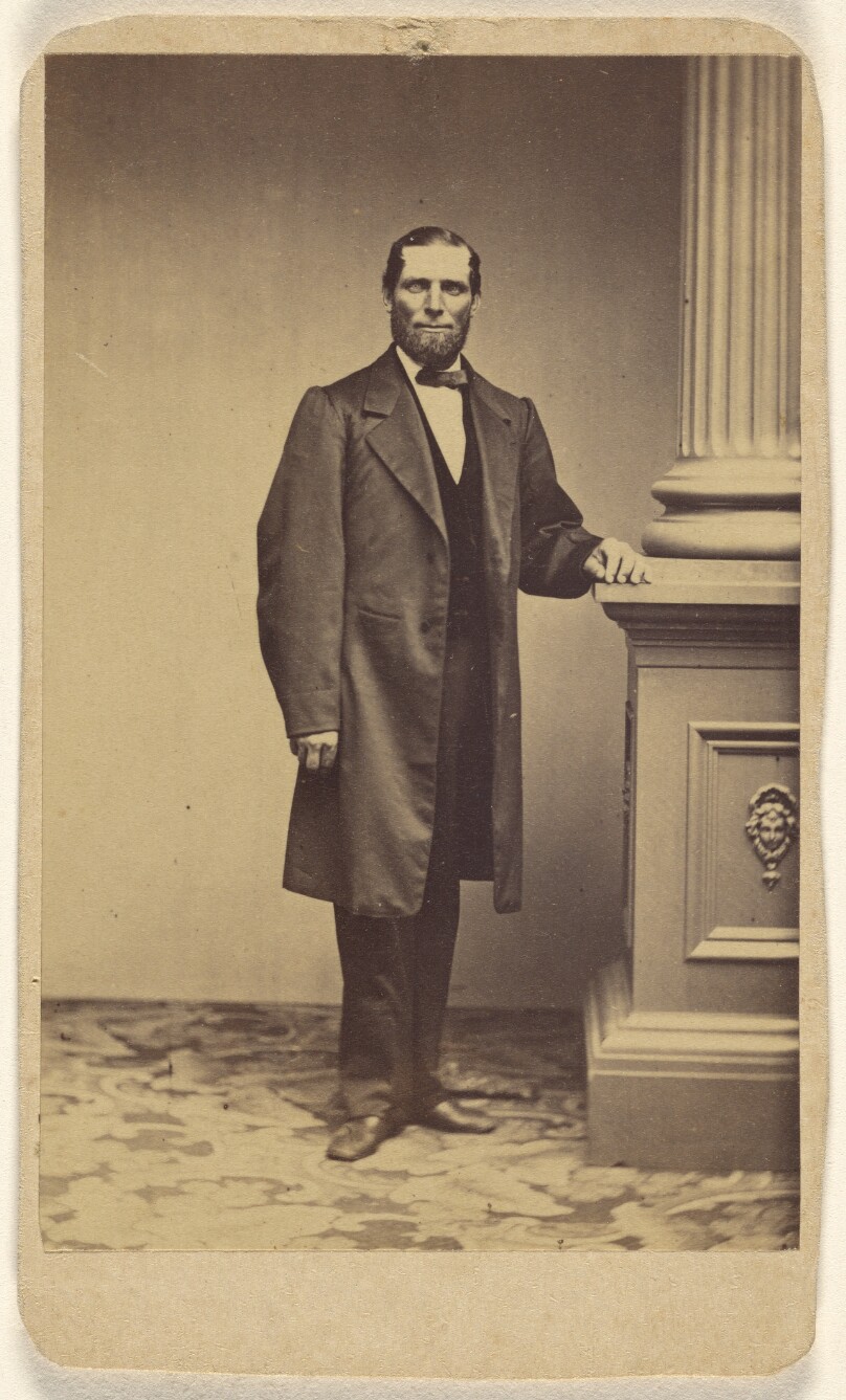 [Unidentified bearded man, standing]