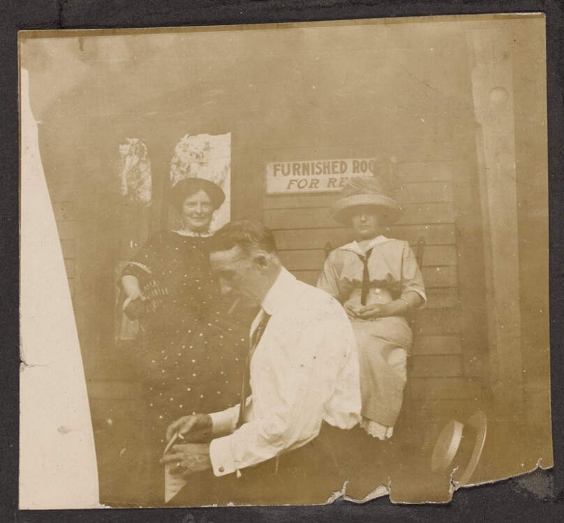 [Group sitting on a porch]