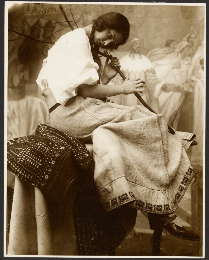 [Seated Female Model Holding Tree Branch]