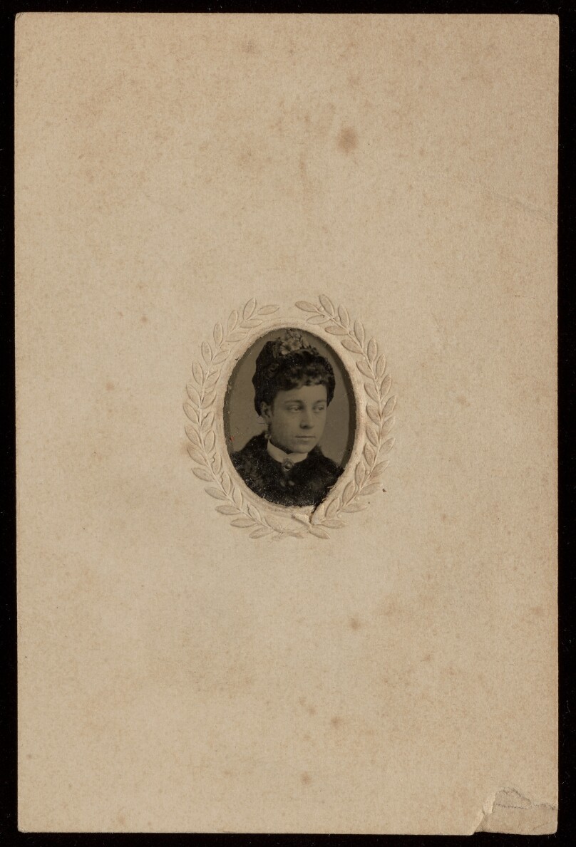 [Unidentified woman wearing a hat]