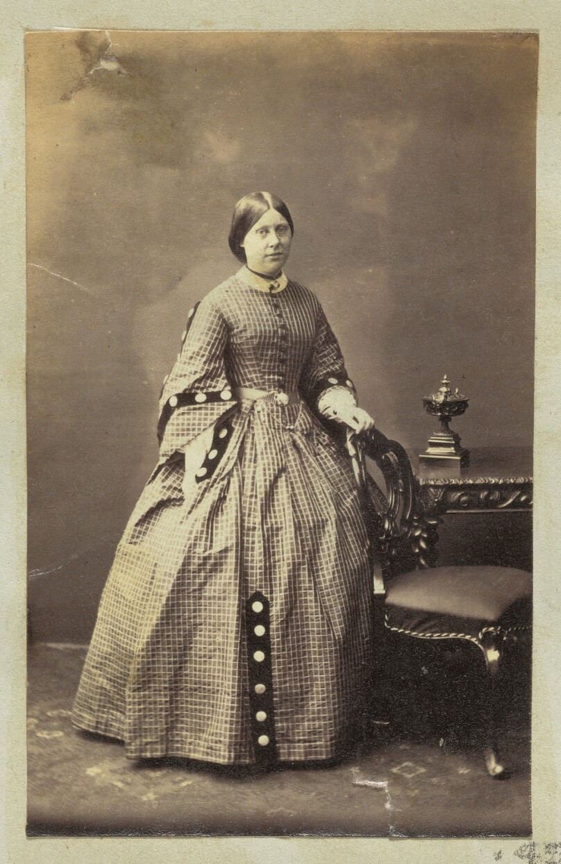 [Portrait of woman in gingham dress]