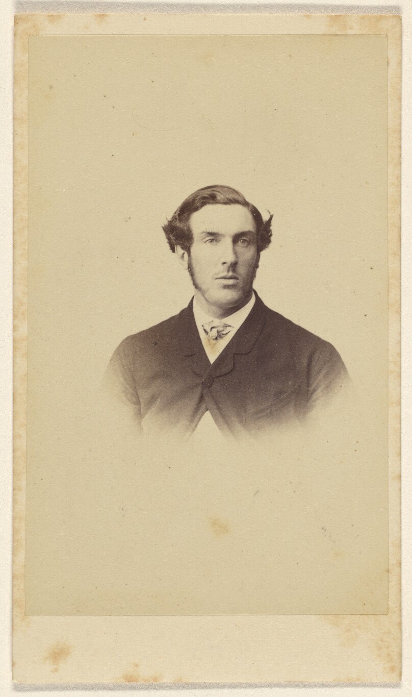 [Unidentified man with long sideburns, in vignette-style]
