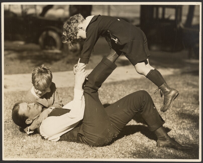 [Man playing with two boys]