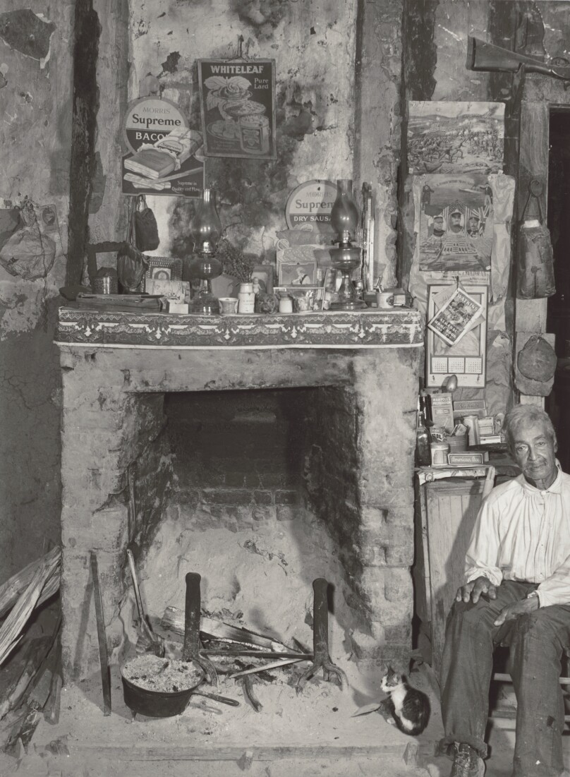 [Man Near a Fireplace]
