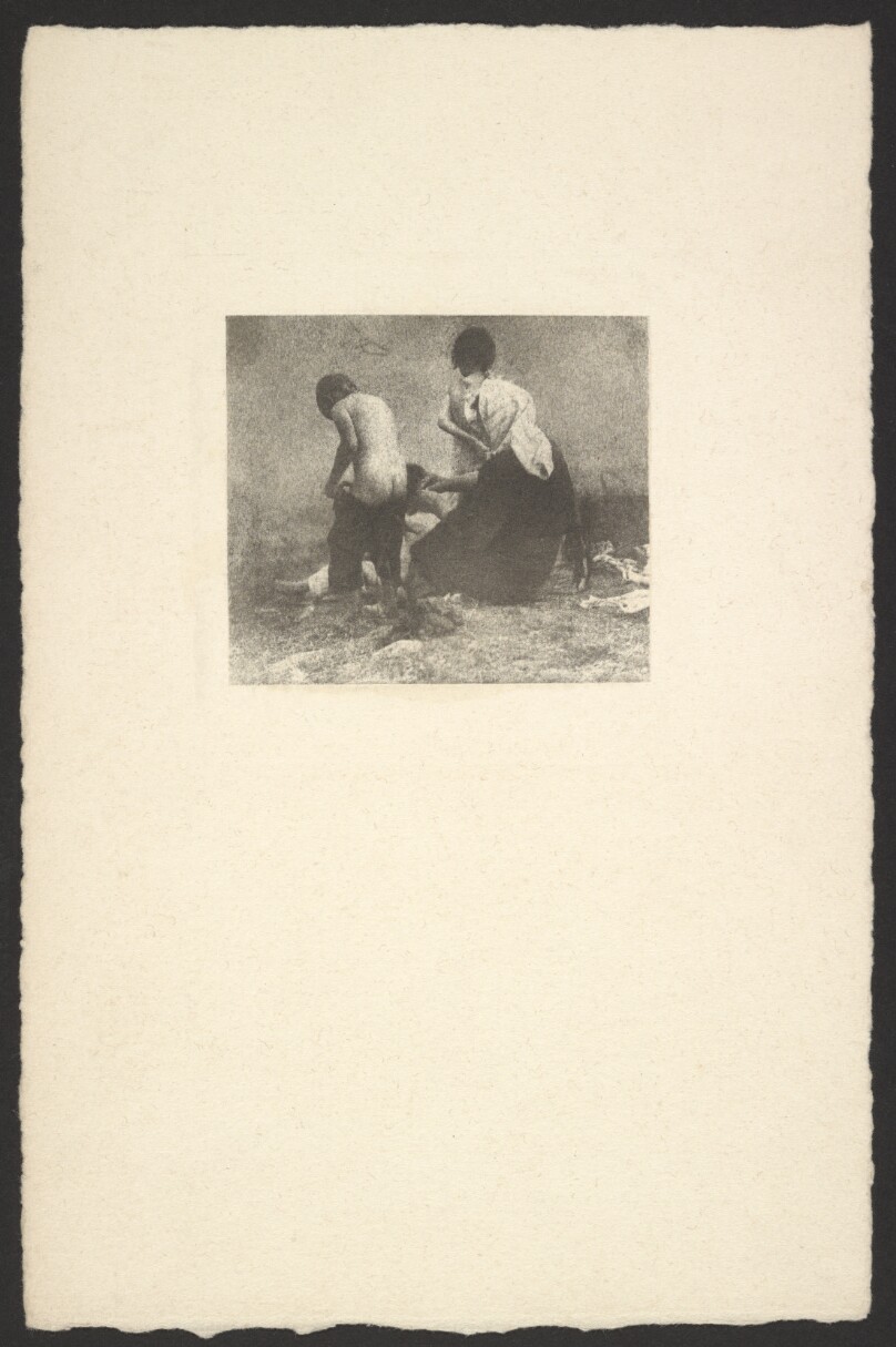 [Woman dressing a child]