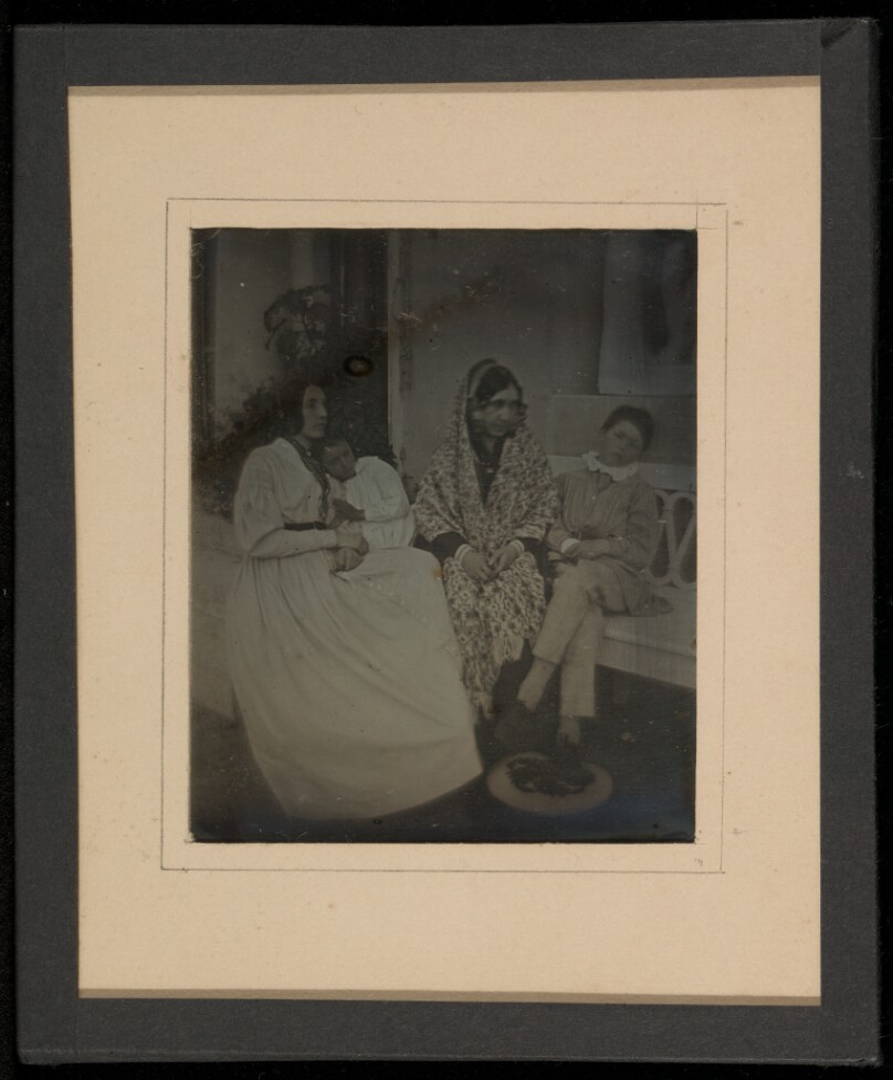 [Group portrait of two mothers and two children]