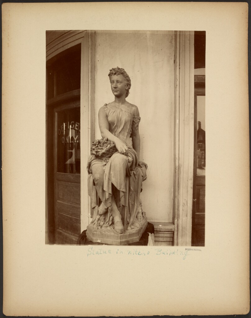 Statue in niche of Building