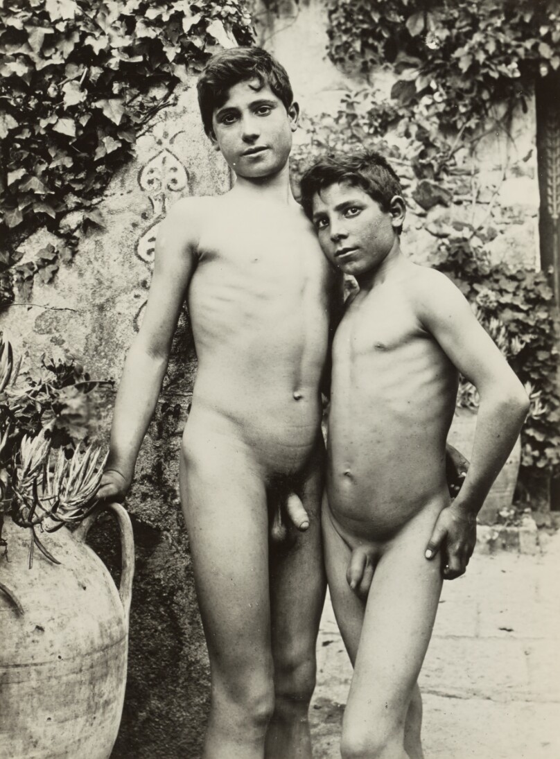[Two nude youths in garden]