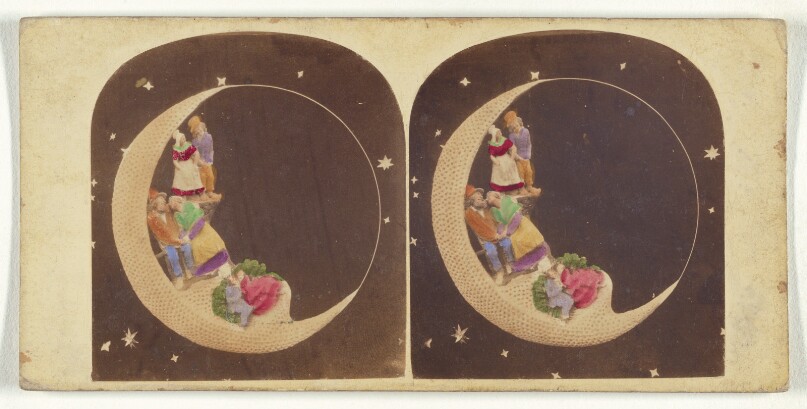 [Dolls dressed in native costumes placed within a fake crescent moon]