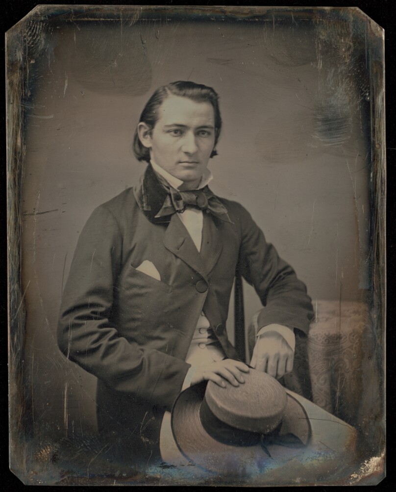 [Portrait of a Seated Man with Hat on Lap]