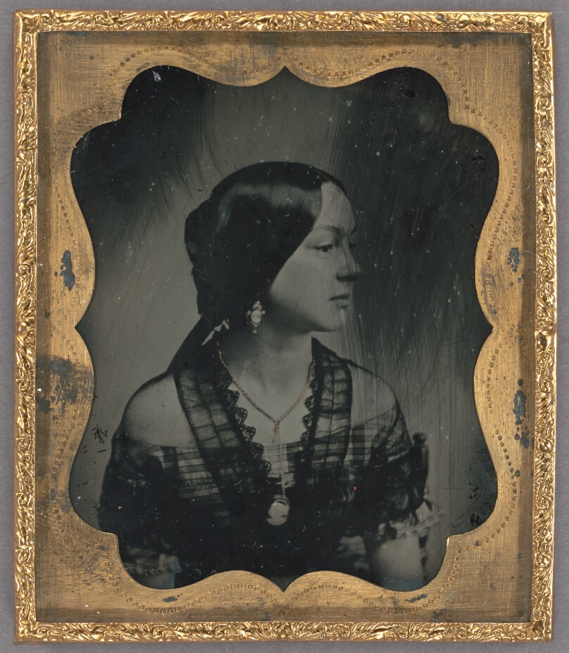 [Profile portrait of a young woman]