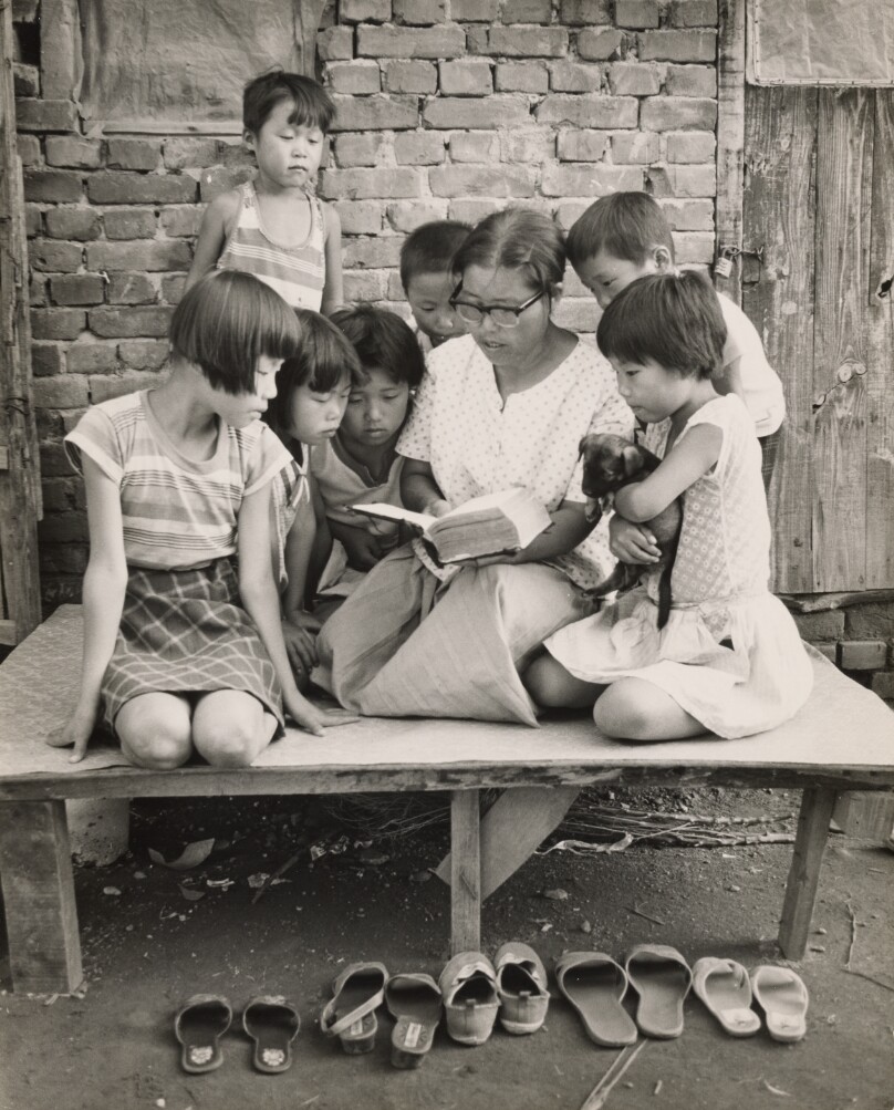 Teacher Reading to School Children
