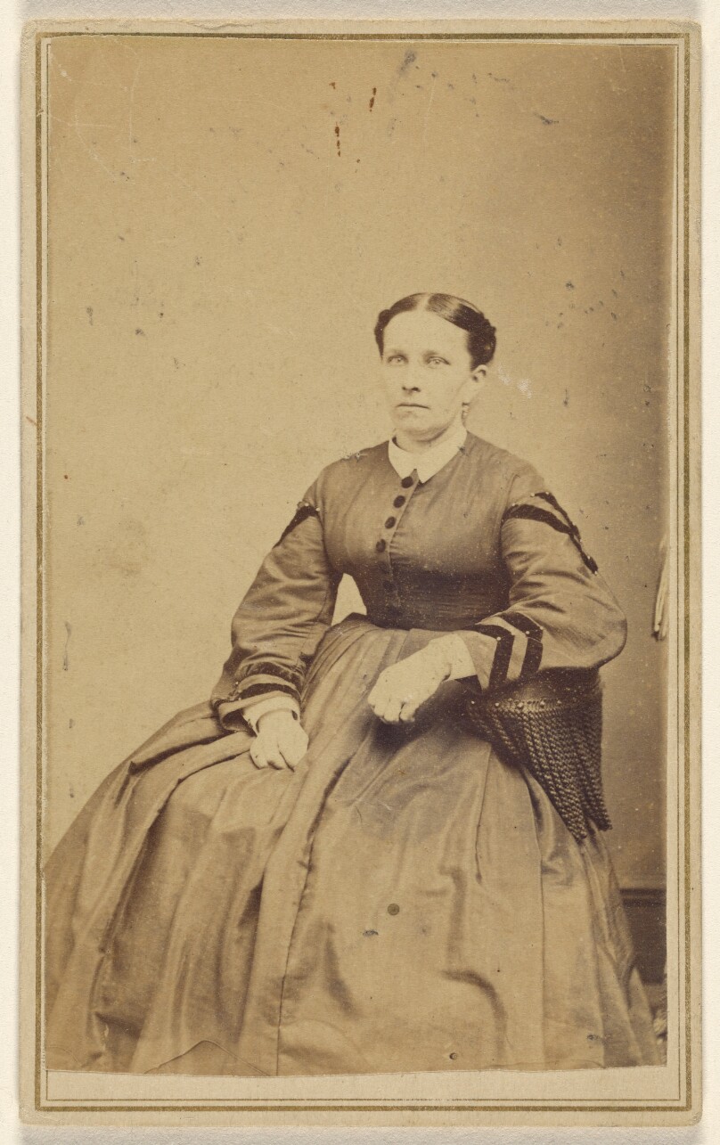 [Unidentified woman seated]