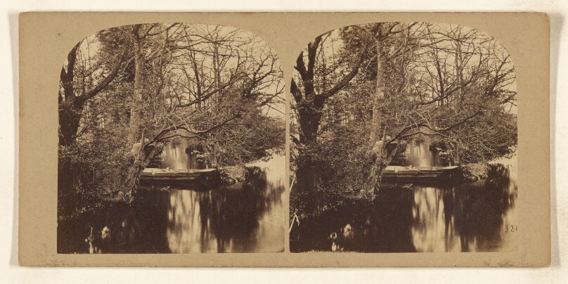 [River scene: man with hat in rowboat]