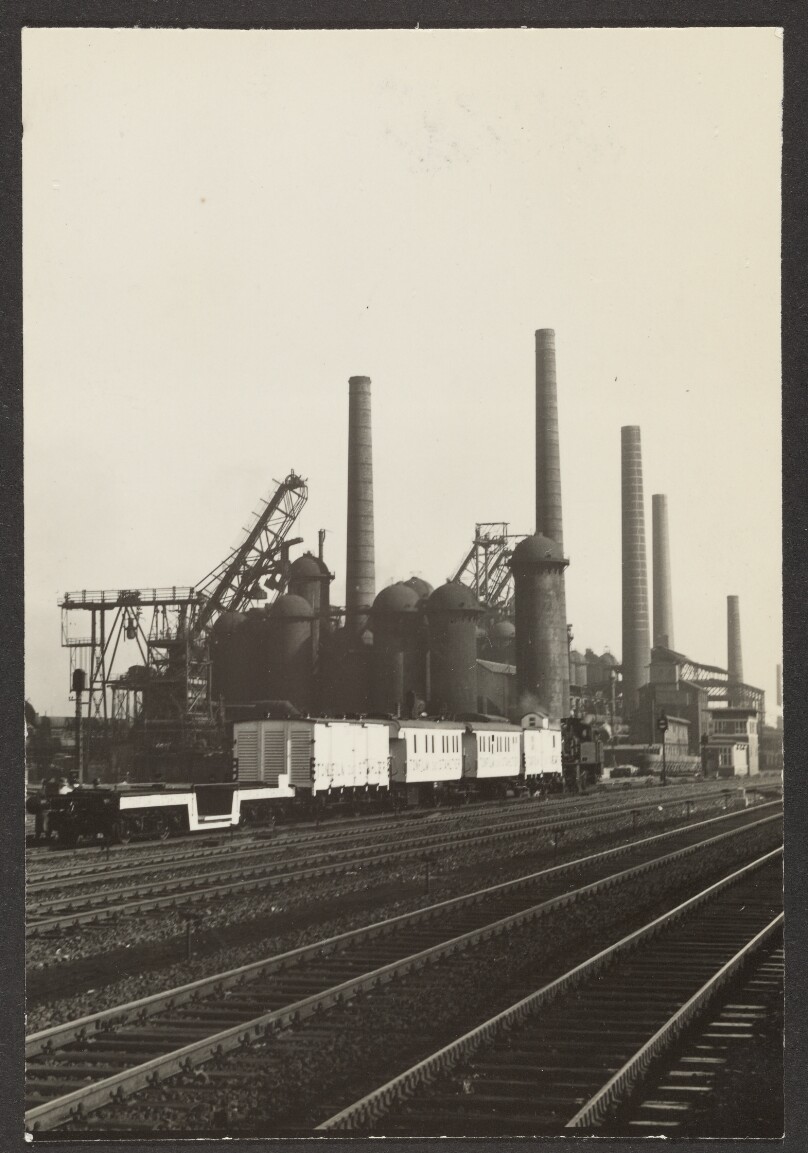 [Industrial building beside railroad tracks]