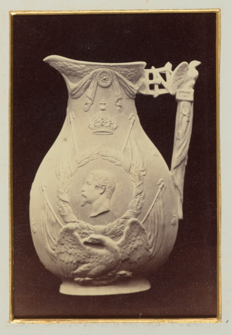 [Ornate water pitcher with a profile of a bearded man on side]