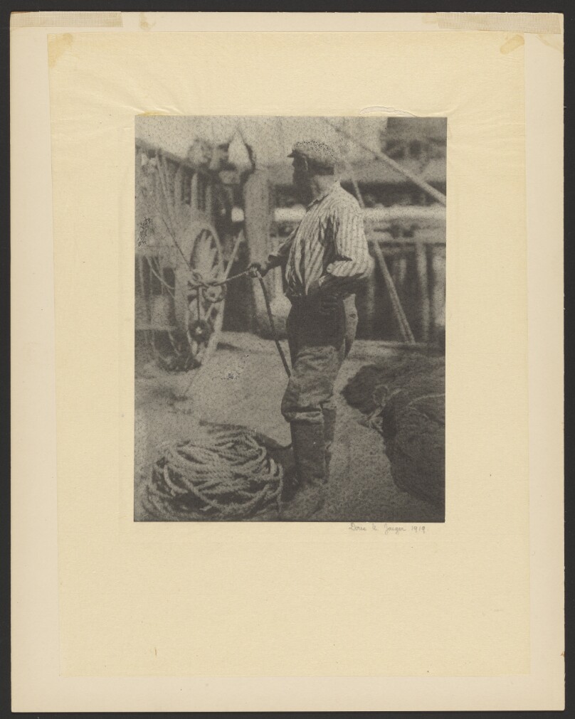 [Sailor on Dock Holding Rope]
