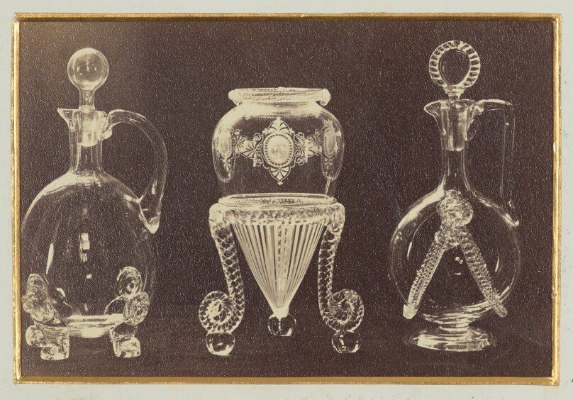 [Two ornate decanters and one inverted vase]