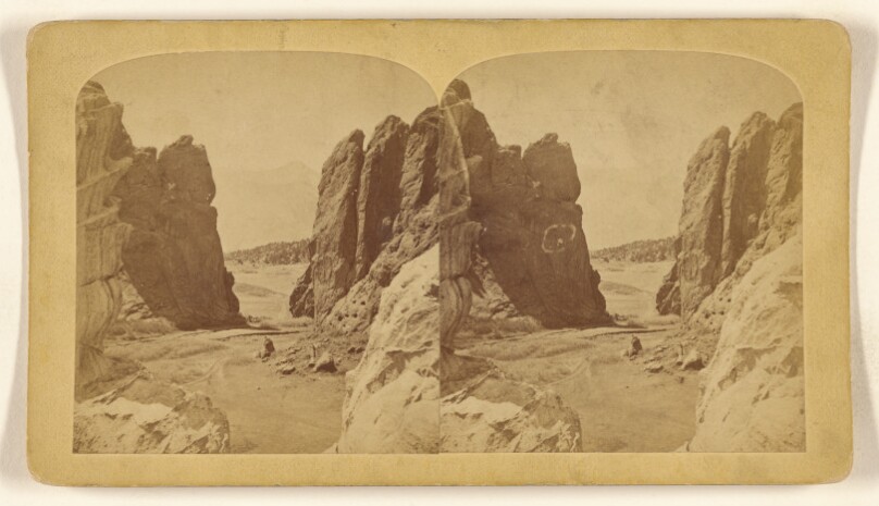 The Gateway, Entrance to the Garden of the Gods, Cameron's Cone in the distant. Formation, Red Sandstone. Height...267 feet...