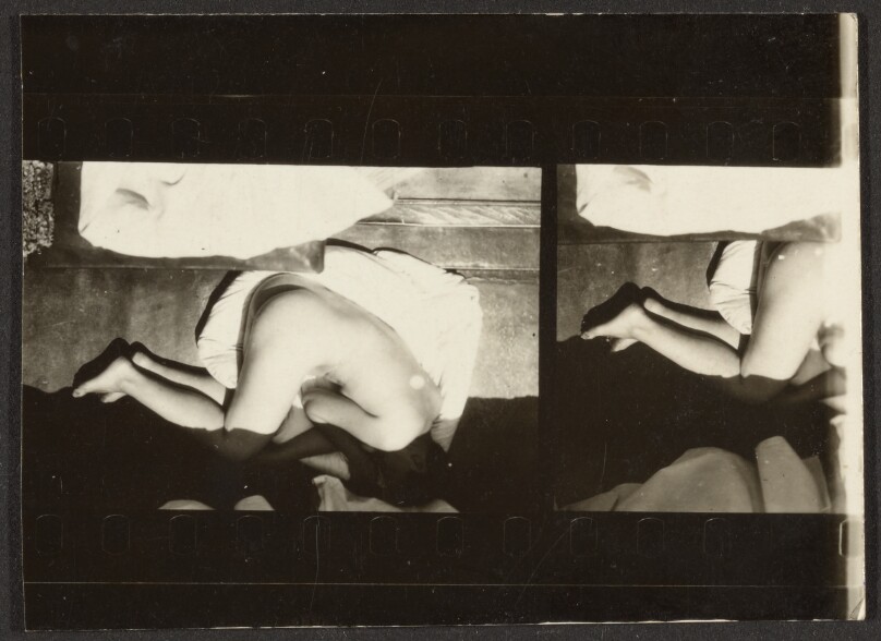 [Contact print-strip from one and one-half 37mm negatives: black border strip above and below image with reclining nude woman seen from above]