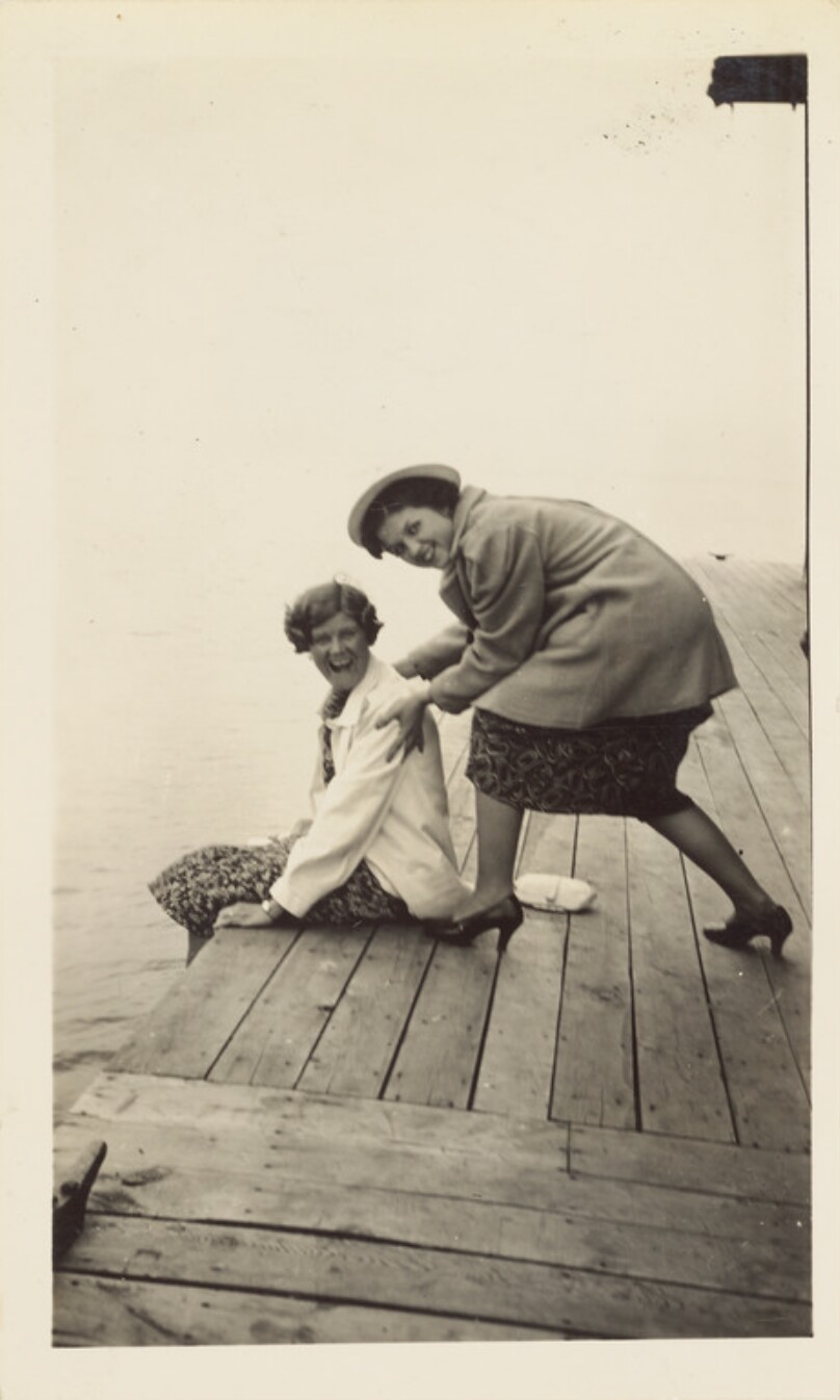 [Two women playing on pier]