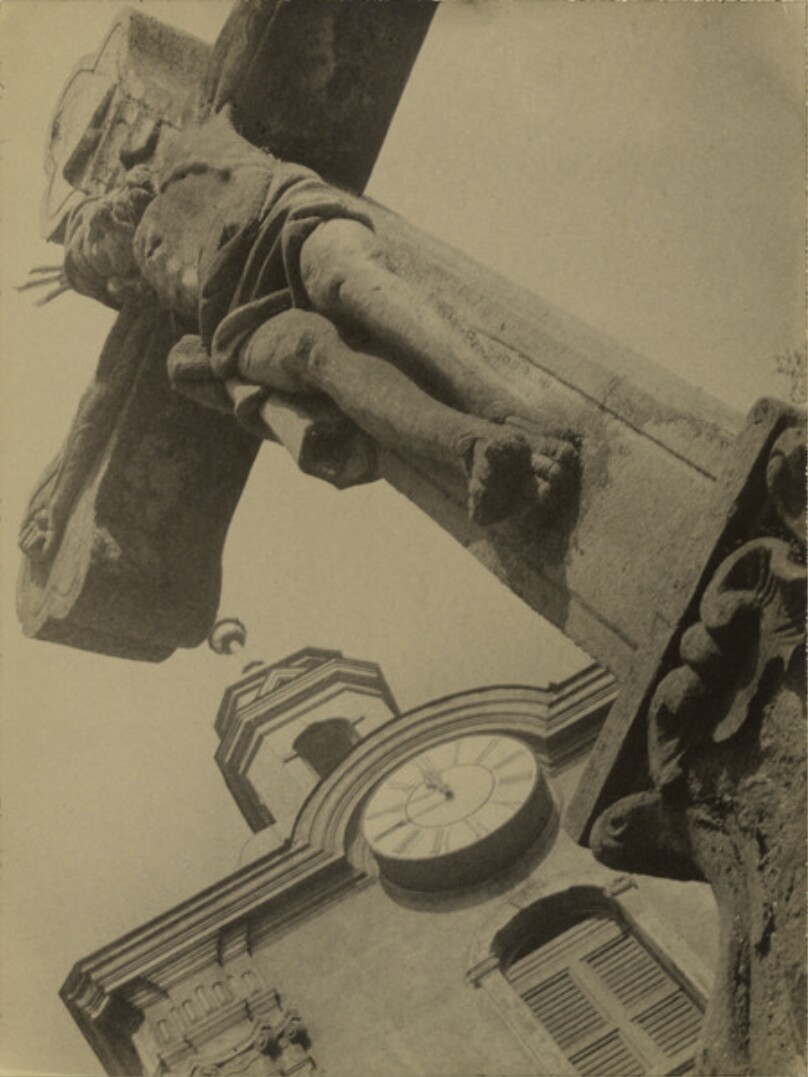 [Diagonal View of Crucifix and Clock Tower]