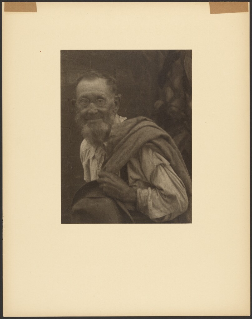 [Bearded Old Man in Glasses, Holding Hat and Coat]