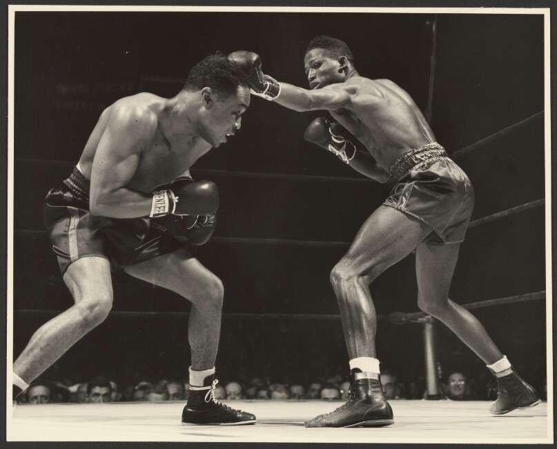 [Two boxers fighting]