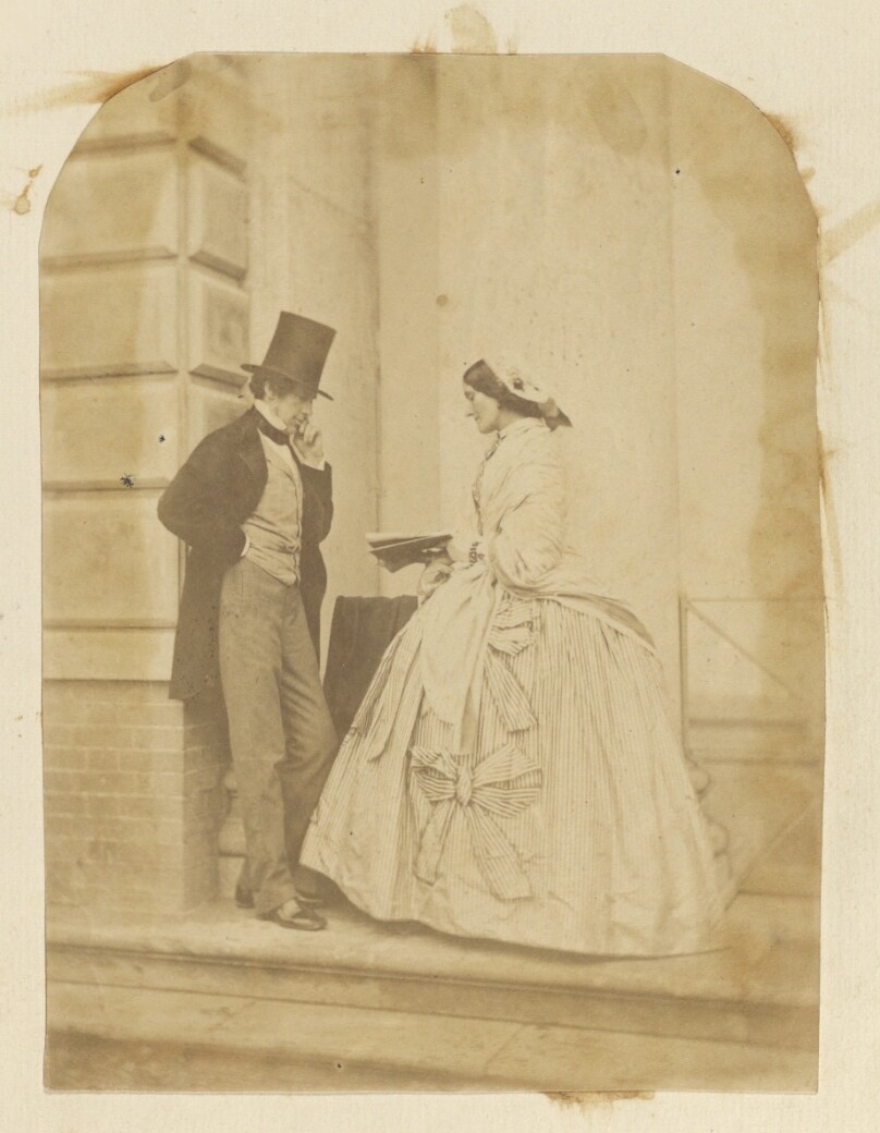 [Man and woman on steps]